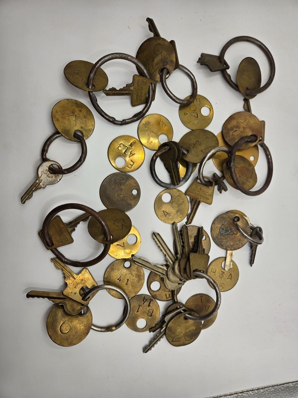 1 lb 6.8 oz Lot of Misc Used Brass Keys, and Brass Key Fobs Used in a Prison